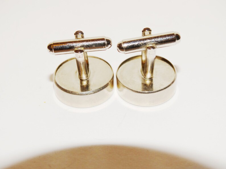 Love me Love me not cufflinks made from stainless steel.