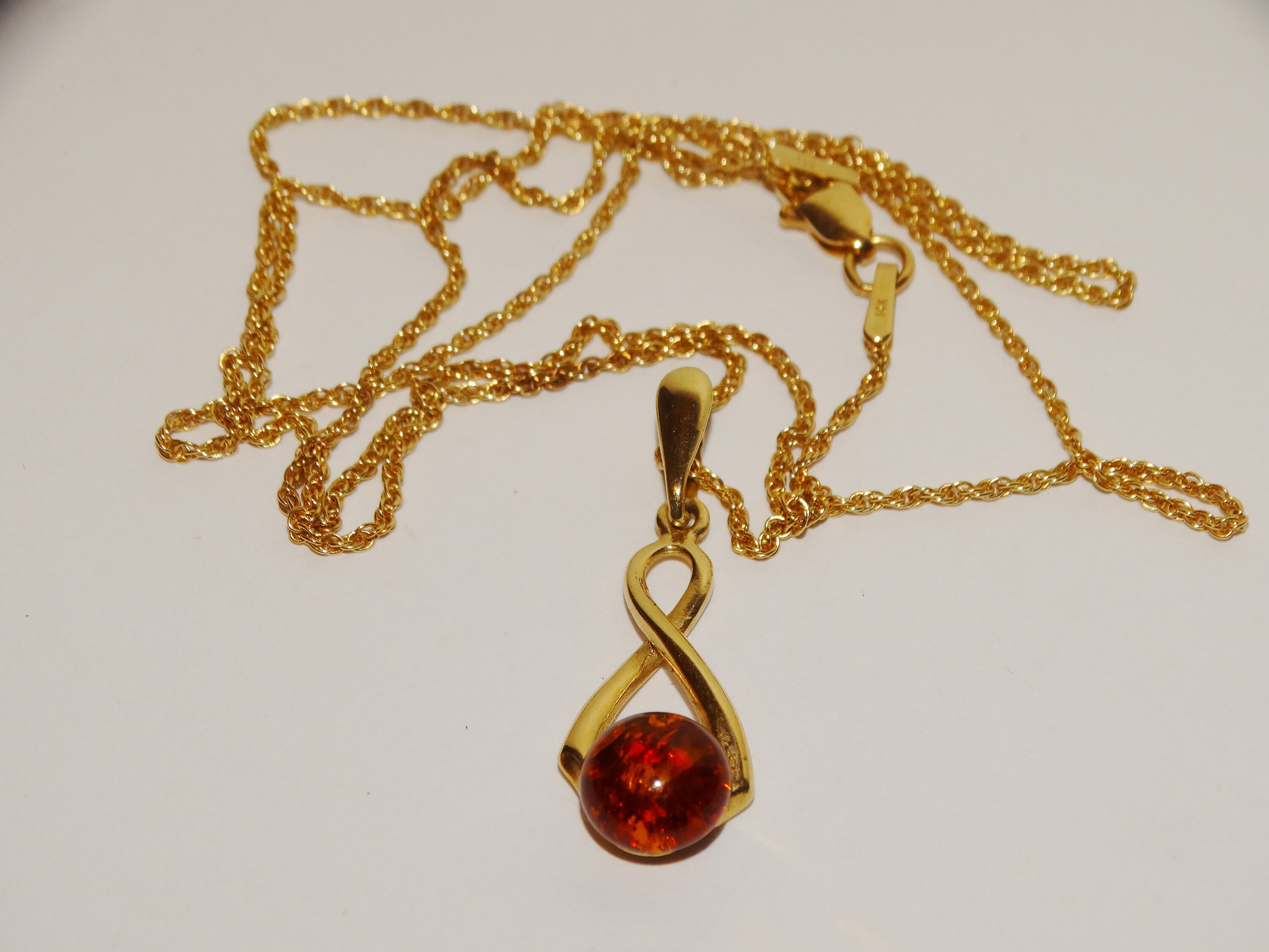 Gold amber pendant discount