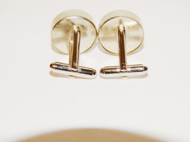 Love me Love me not cufflinks made from stainless steel.