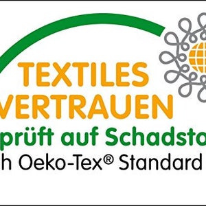 Puede incluir: Logotipo verde y amarillo con el texto "TEXTILES VERTRAUEN" y las palabras "Gepr&uuml;ft auf Schadstoffe nach Oeko-Tex&reg; Standard 100".