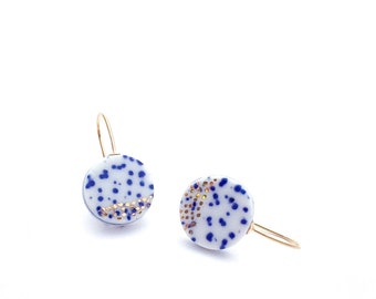 Porcelain dangle earrings in blue and white ceramics with golden stardust