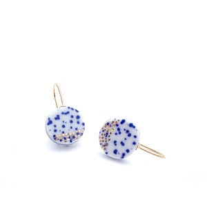 Porcelain dangle earrings in blue and white ceramics with golden stardust