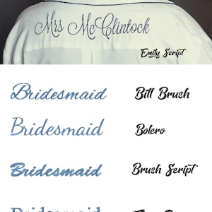 May include: A white shirt with dark blue embroidery reading Mrs McClintock in Emily Script. Below, a list of the word Bridesmaid embroidered in blue using four different fonts labeled Bill Brush, Bolero, Brush Script, and Times Roman.
