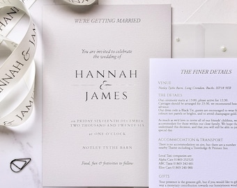 Elegant neutral tone custom stacked wedding invitation suite with pearl wrap and ribbon