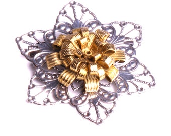 Broche art déco joya de diseño con acabado en plata y oro fabricada en Francia.