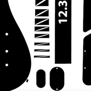 May include: Black and white guitar body template with various cutouts for different parts, including a pickguard, control plate, and a bridge. The template also includes a fretboard with 12 frets and a headstock with the text "12:3".