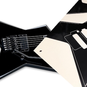 Peut inclure: Guitare électrique noire avec un corps en forme d'étoile et une longueur d'échelle de 63 cm. La guitare a une finition noire et un pickguard noir. La guitare est présentée avec un modèle pour un autocollant personnalisé.