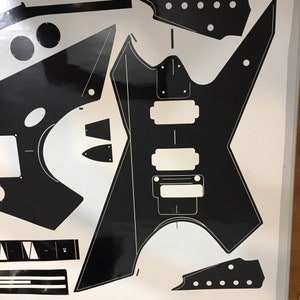 80's hair metal pointy vinyl guitar template. Star style shape. Front and back routes.  headstock  24 neck,  2 humbucker/w Floyd. Ships free