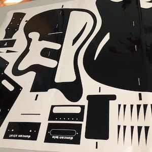 surfcaster guitar template with cutouts for the body, neck, and pickups. The template includes the text "Duncan tele" and "Duncan Strat".