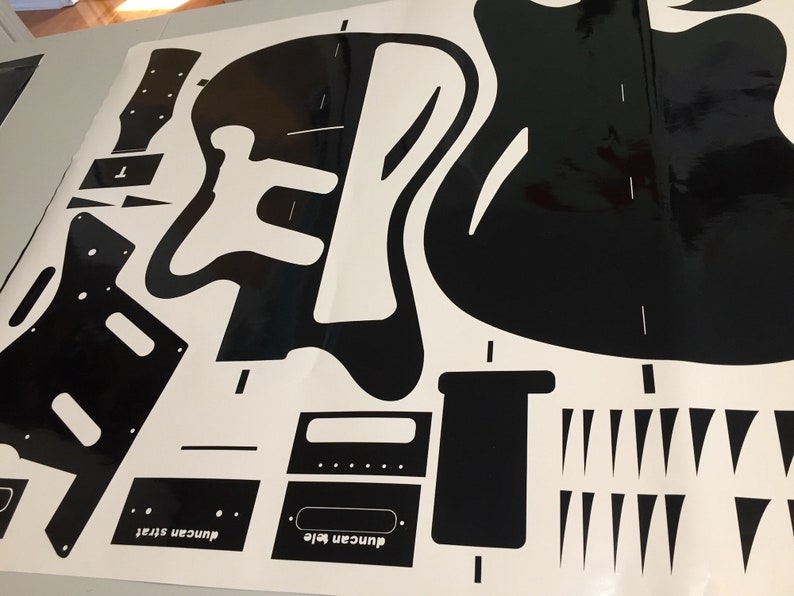 surfcaster guitar template with cutouts for the body, neck, and pickups. The template includes the text "Duncan tele" and "Duncan Strat".