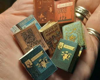 Antique replica set of 8 dolls house miniature books in 1:12 scale that open with blank  pages inside.