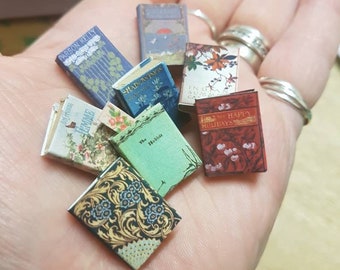 Antique replica set of 8 dolls house miniature books in 1:12 scale that open with blank  pages inside.