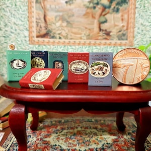 Chronicles of Narnia 1:12 scale dollhouse miniature vintage bookset.Each book has turnable blank  pages. Loose bookmark included.