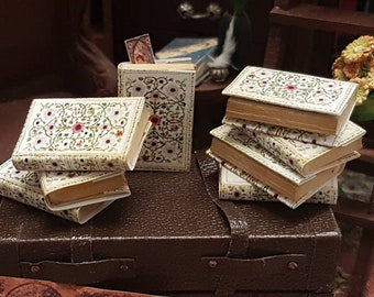Tudor rose encyclopedia  set of 8 dolls house miniature books in 1:12 scale that open with blank  pages inside.A loose bookmark included.