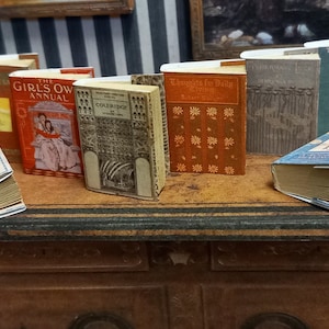 Antique replica  set of 8  dolls house miniature books in 1:12 scale that open with blank  pages inside.