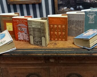 Antique replica  set of 8  dolls house miniature books in 1:12 scale that open with blank  pages inside.
