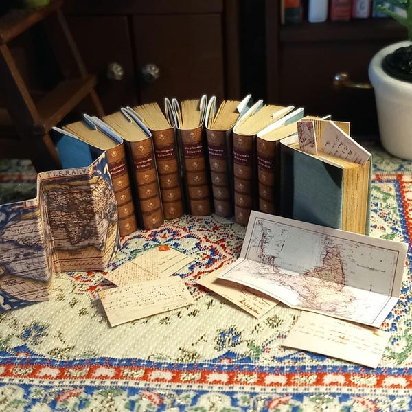Encyclopedia Britannica collection of 8 novels in 1:12 scale dollhouse miniature. Each book has aged turnable blank pages inside.