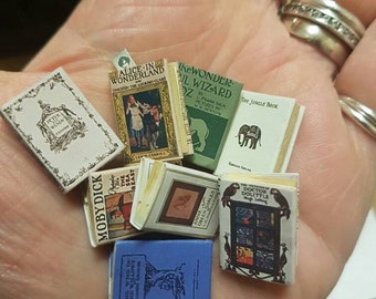 Miniature 1:12 scale children's dollhouse room  library set . Each book has aged turnable blank pages. A loose bookmark is also included.