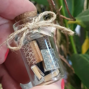 Tiny books in a bottle - Vial with 1:24 scale vintage miniature books inside.
