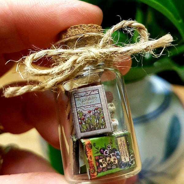 Tiny books in a bottle - Vial with 1:24 scale vintage miniature books inside.