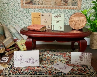 Winnie the pooh set of 4 dolls house miniature books in 1:12 scale that open with blank  pages inside.Props included.