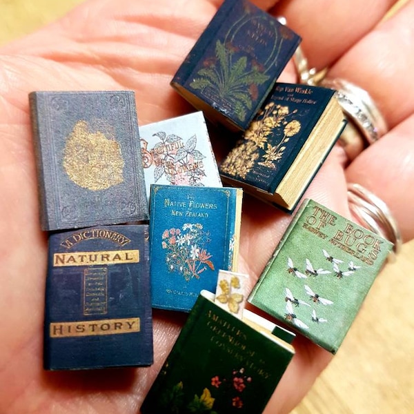 Antique replica set of 8 dolls house miniature books in 1:12 scale that open with blank  pages inside.