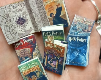 First edition US replica set of 7 dolls house miniature potter books in 1:12 scale that open with blank  pages inside. Marauder map included