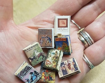 Antique replica childrens set of 8 dolls house miniature books in 1:12 scale that open with blank  pages inside.