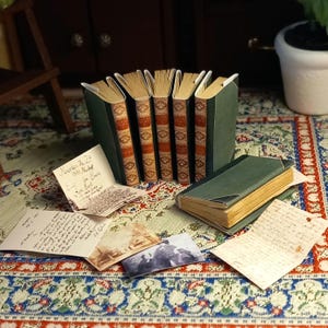 The Bronte sisters collection of 6 novels in 1:12 scale dollhouse miniature. Each book has aged turnable blank pages inside.