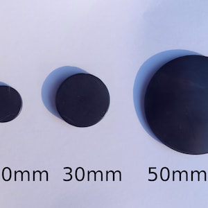 May include: Three black round discs of different sizes, measuring approximately 20mm, 30mm, and 50mm in diameter.