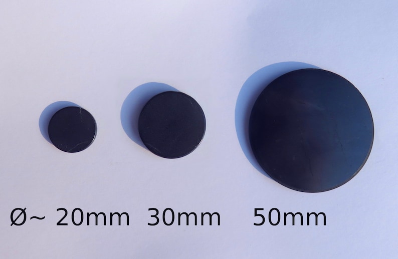 May include: Three black round discs of different sizes, measuring approximately 20mm, 30mm, and 50mm in diameter.
