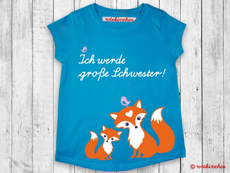 Big Sister T-Shirt 'Ich Werde Große Schwester 2026' - Regenbogen Design Für Schwangerschaftsverkündung