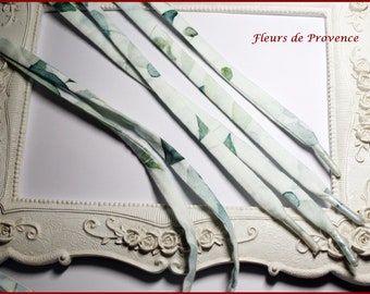 Pair of shoelaces in Liberty fabric with green eucalyptus leaves