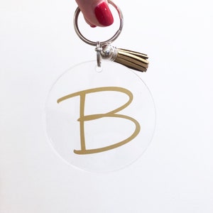 Monogram sleutelhanger met kwastje