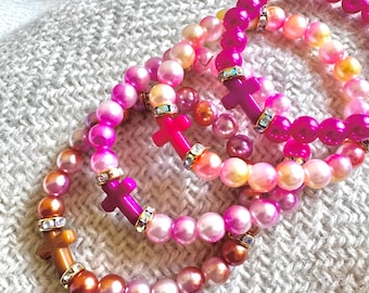 Pulsera con cruz: Joyería religiosa, rosa, elástica