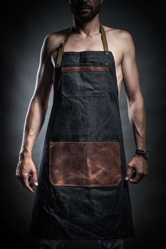 Denim apron with leather pockets and military belts by