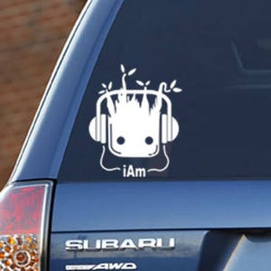 May include: White vinyl car sticker featuring a cartoon character with headphones and the text "iAm".