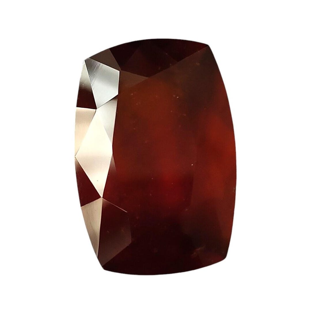 Faceted Red Hessonite Garnet: 31.75 Carat Long Cushion Cut Natural