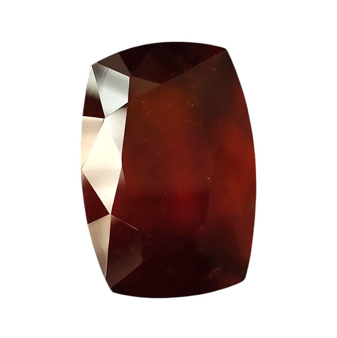 Faceted Red Hessonite Garnet: 31.75 Carat Long Cushion Cut Natural