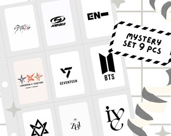 May include: A set of nine photo cards featuring logos of different K-pop groups, including Stray Kids, Ateez, Enhypen, Tomorrow X Together, Seventeen, BTS, Astro, ZB1, and IVE. The cards are white with black logos and are arranged in a grid.
