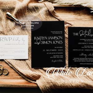 May include: Black and white wedding invitation suite with a minimalist design. The invitation features the couple's names, date, and location. The RSVP card includes a space for guests to provide their names and RSVP by mail or online. The details card includes information about the ceremony and reception.