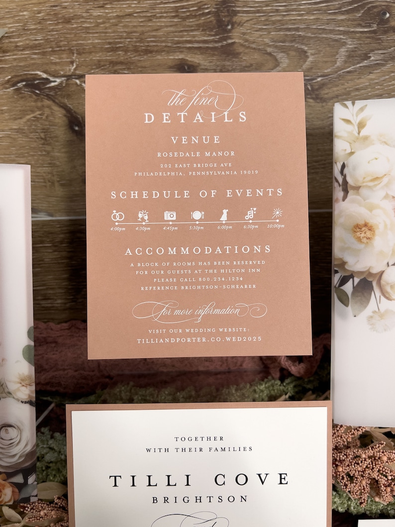 Taupe wedding details card with elegant typography and coordinating peach floral stationery.
