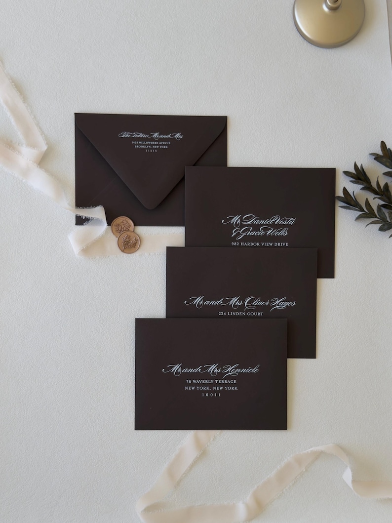 Chocolate wedding envelopes with elegant white ink guest and return address printing
