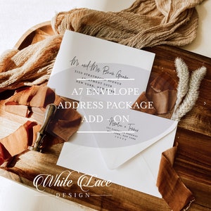 May include: A white A7 envelope with a clear plastic overlay with the text "Mr. and Mrs. Brad Greek" and "3120 Strathmore Avenue, Apartment 2028, New York, New York" printed on it. The overlay also has the text "A7 Envelope Address Package Add-On" printed on it. The envelope is on a wooden surface with a brown ribbon and a wax seal.