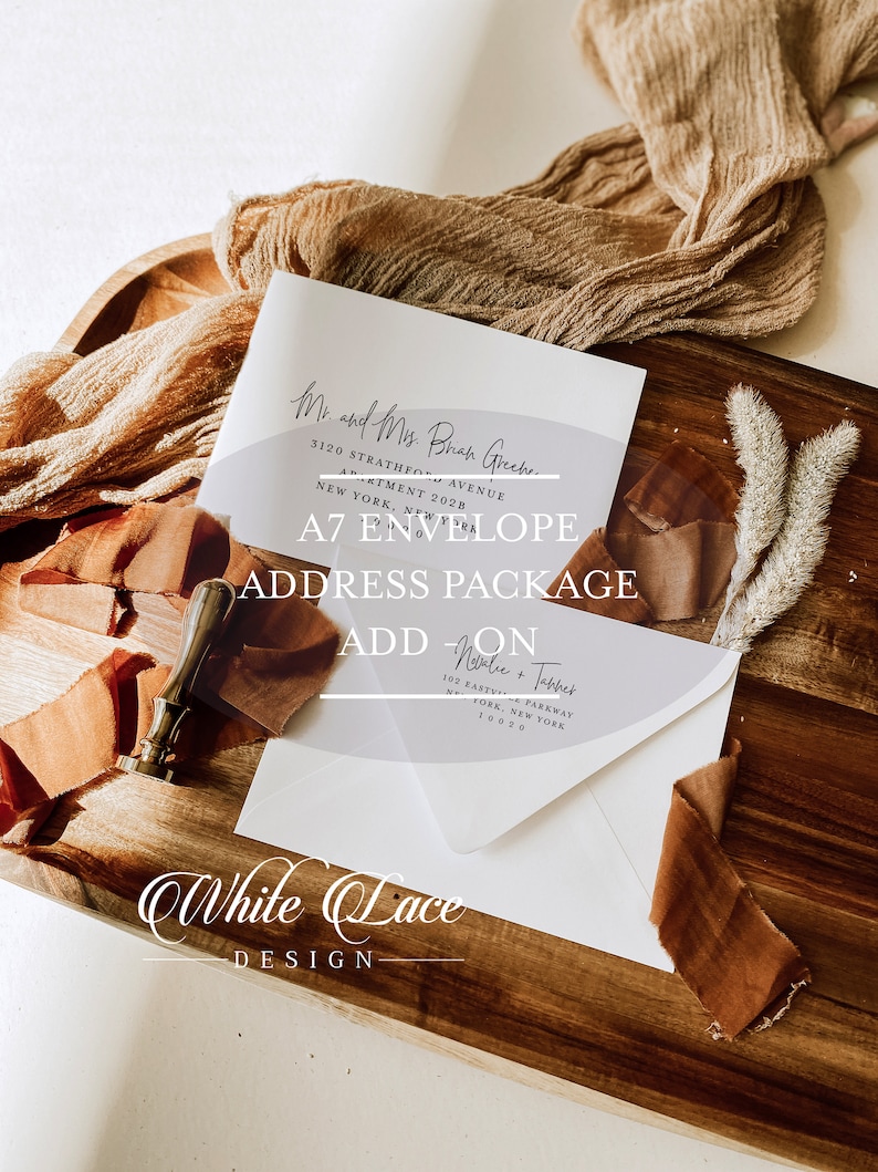 May include: A white A7 envelope with a clear plastic overlay with the text "Mr. and Mrs. Brad Greek" and "3120 Strathmore Avenue, Apartment 2028, New York, New York" printed on it. The overlay also has the text "A7 Envelope Address Package Add-On" printed on it. The envelope is on a wooden surface with a brown ribbon and a wax seal.