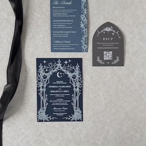 Ophelia celestial wedding stationery featuring a midnight navy invitation with ornate white ink archway, coordinating Marina details card, and Dark Grey tombstone-shaped RSVP website card with QR code.