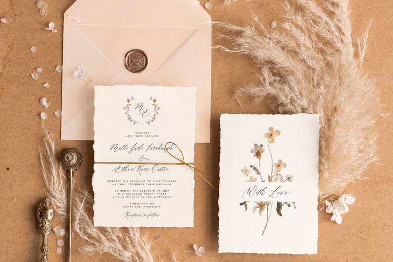 May include: Wedding invitation suite with a rustic, floral theme. The invitation features a wreath with the initials "M&E" and the text "Together with their families" above the names "Mello Jade Farraday & Ethan Kane Castro". The RSVP card features a watercolor illustration of dried flowers with the text "With Love".