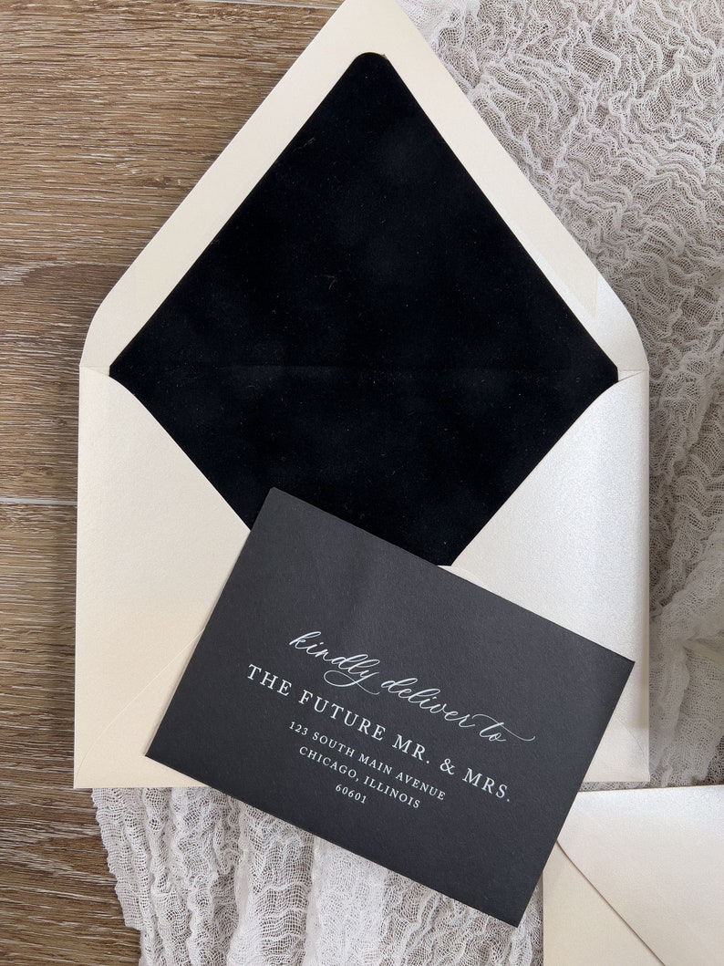 May include: A black envelope with a white envelope liner. The envelope is addressed to "The Future Mr. & Mrs." with an address in Chicago, Illinois.