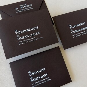 Dark brown wedding envelope with bold abstract liner with white ink addresses printed on the front
