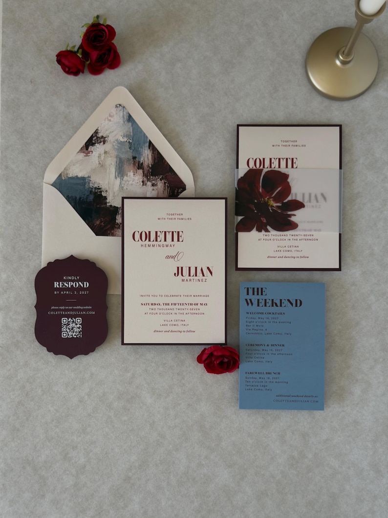 Complete burgundy and dusty blue floral wedding invitation suite with ivory invitation, blue details card, scalloped burgundy RSVP and burgundy A7 envelope featuring a dramatic floral liner.